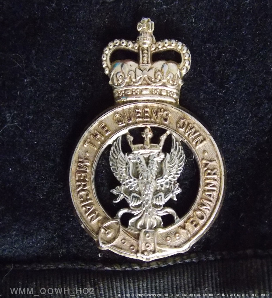 The Queens Own Mercian Yeomanry cap badge detail.